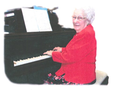 Aunt Edith at the piano. (In the 1930s she married the happy little boy pictured above, my Uncle Helmer.