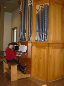 Marian playing the tracker pipe organ at Messiah Lutheran Church in Madison.