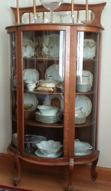 Mom's china cabinet. It's in our dining room now, filled with Mom's china instead of all the other treasures it used to house.