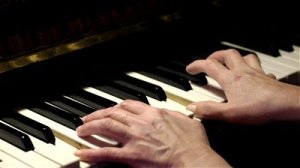 Hands playing piano