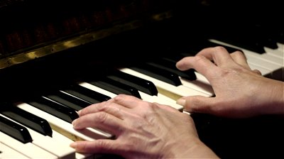 Hands playing piano