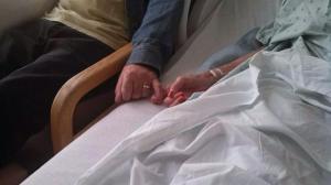 Sandy and Conrad holding hands