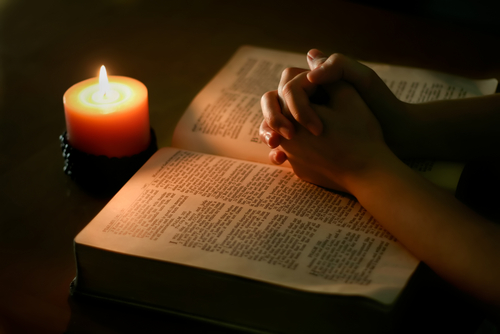 Bible-candle-praying hands