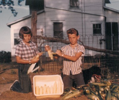 Danny and I had to work together a lot. Here we are spending most of a summer day husking sweet corn for Mom to freeze.